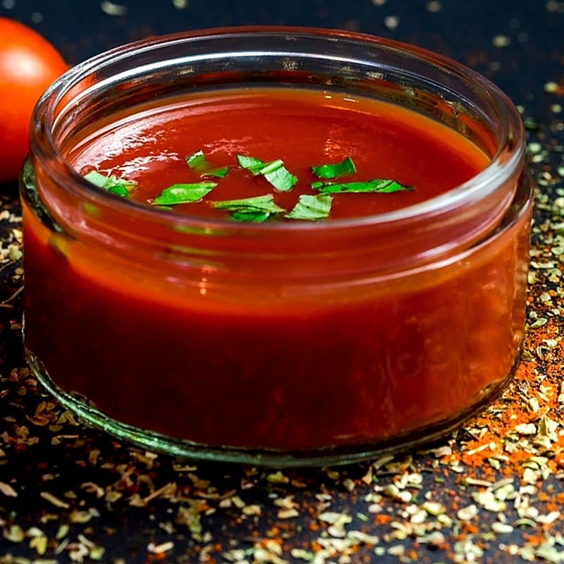 Glass bowl of smooth tomato sauce
