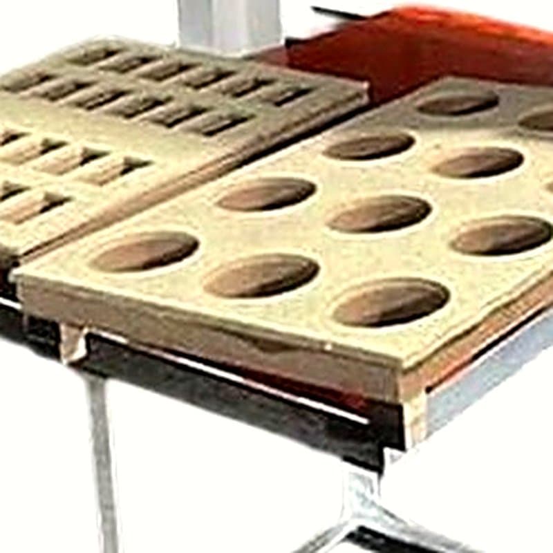 Two cavity trays of a hydraulic scrubber packing machine with round and rectangular pockets