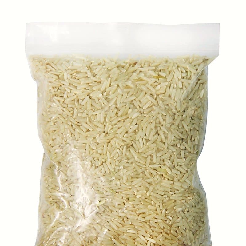 Clear plastic pouch of rice with a flat heat seal across the top