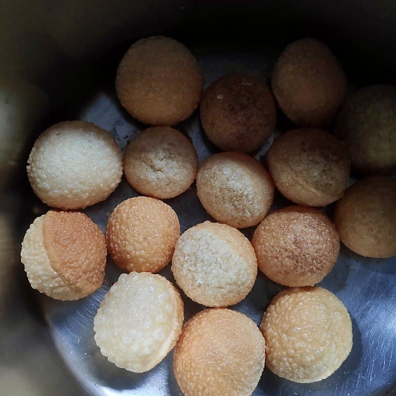 Fried pani puri shells in a steel bowl