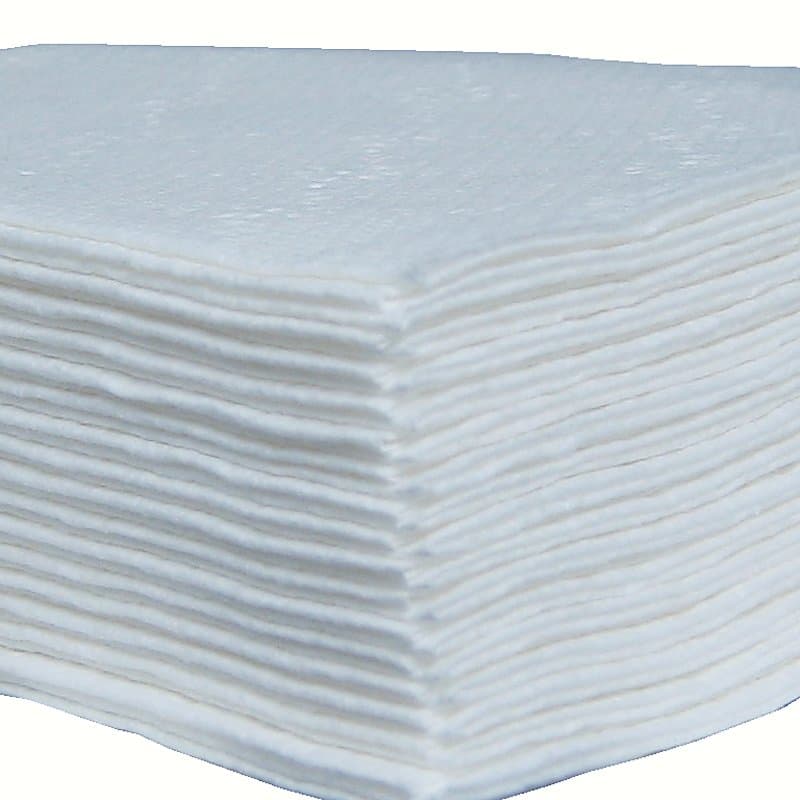 Neat stack of folded white paper napkins ready for packing